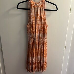 Orange and cream halter dress.